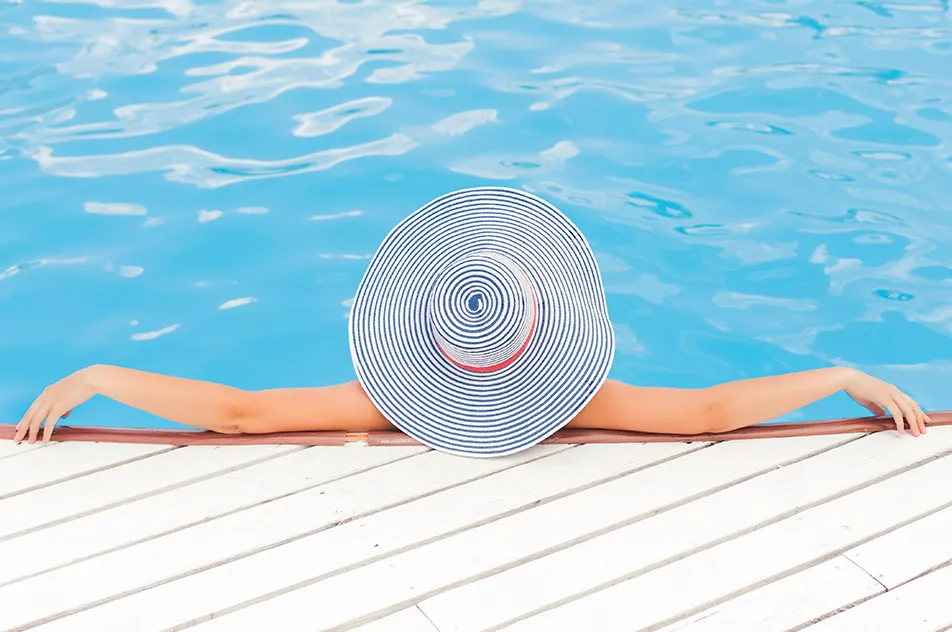 woman in swimming pool during daytime