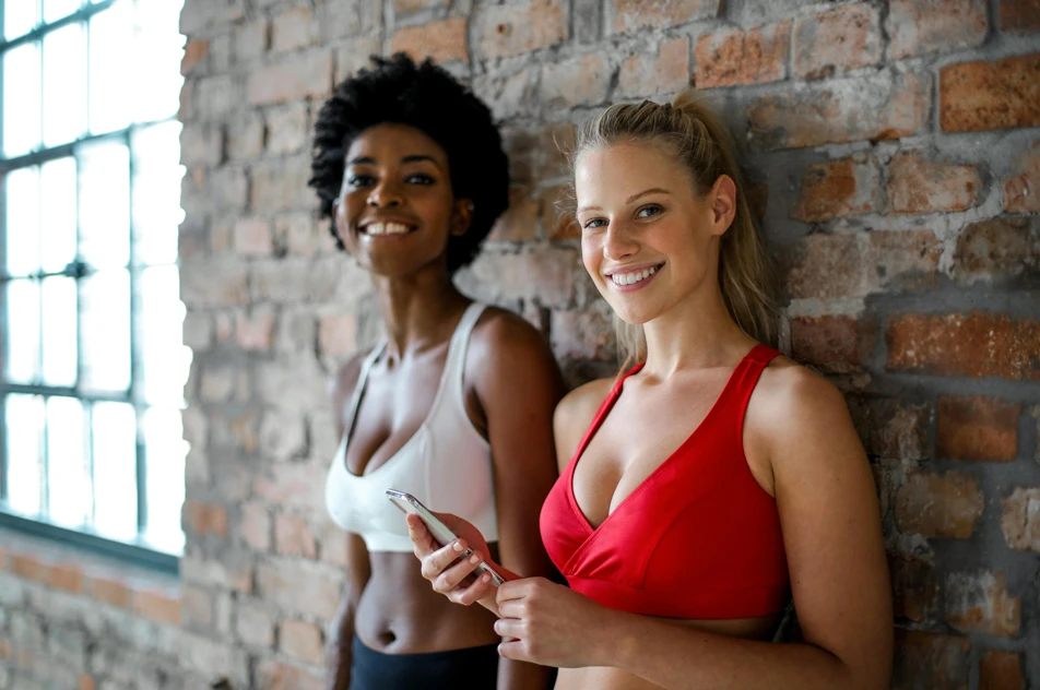 women smiling after a breast augmentation