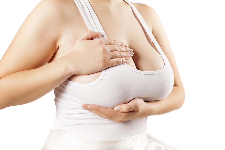 Close-up of breasts showing support and reshaping associated with breast reduction and lift surgery