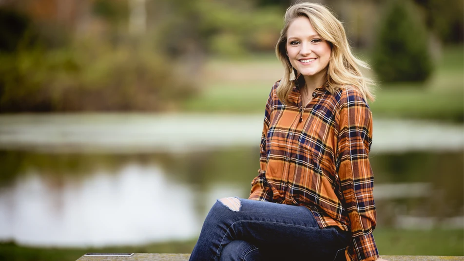 Smiling woman outdoors representing confidential pelvic floor repair treatment advice